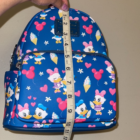 AUTHENTIC DISNEY MERCHANDISE— LOUNGEFLY DONALD & DAISY Backpack - Picture 2 of 6